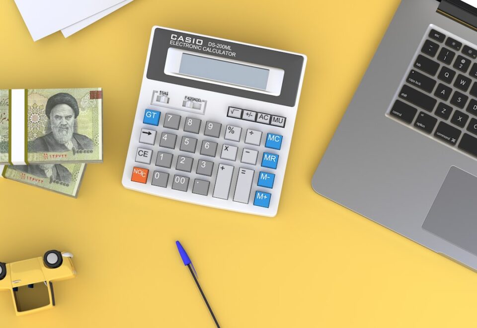 zero-based budget cover illustration with calculator, receipts, envelopes, and a spreadsheet
